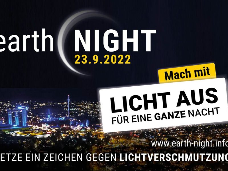 Sujet mit beleuchteter Stadt und dunklem Himmel